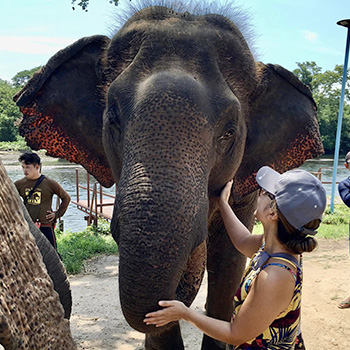 Kira Omelchenko at an elephant sanctuary in Thailand