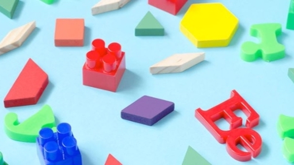 A collection of shapes, building blocks and letters