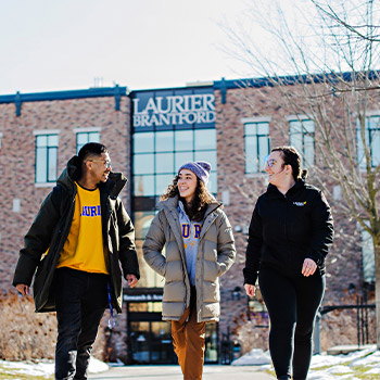 Three students walking by the Laurier Brantford YMCA