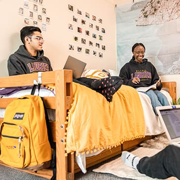 Students studying in a dorm room