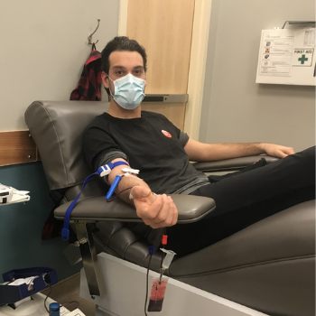Young man donating blood.