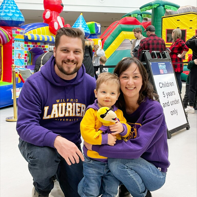 Family at Laurier Brantford Purple and Gold Party