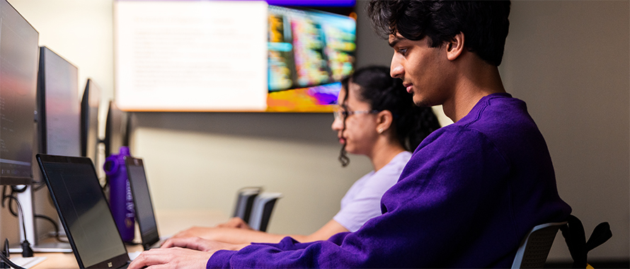 Two students working at computers